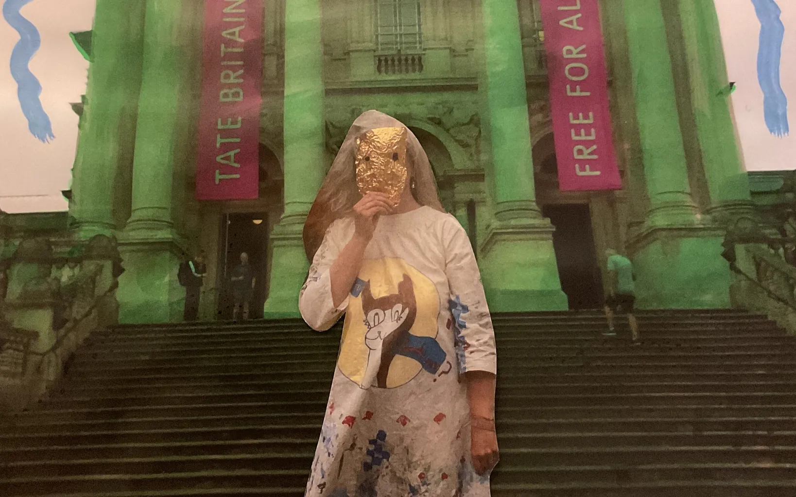 A person in a decorated dress and veil stands in front of Tate Britain, holding something to their face. Two banners read "Tate Britain" and "Free For All." Blue lines frame the top of the image.