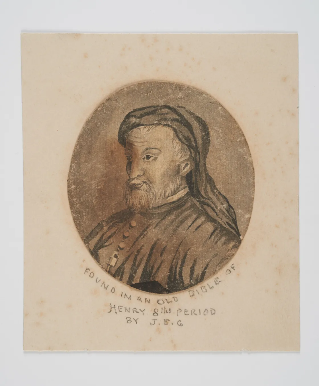 A sepia-toned portrait of a man with a beard and a cap, encircled by the inscription: "Found in an old Bible of Henry 8th period by J.F.G.