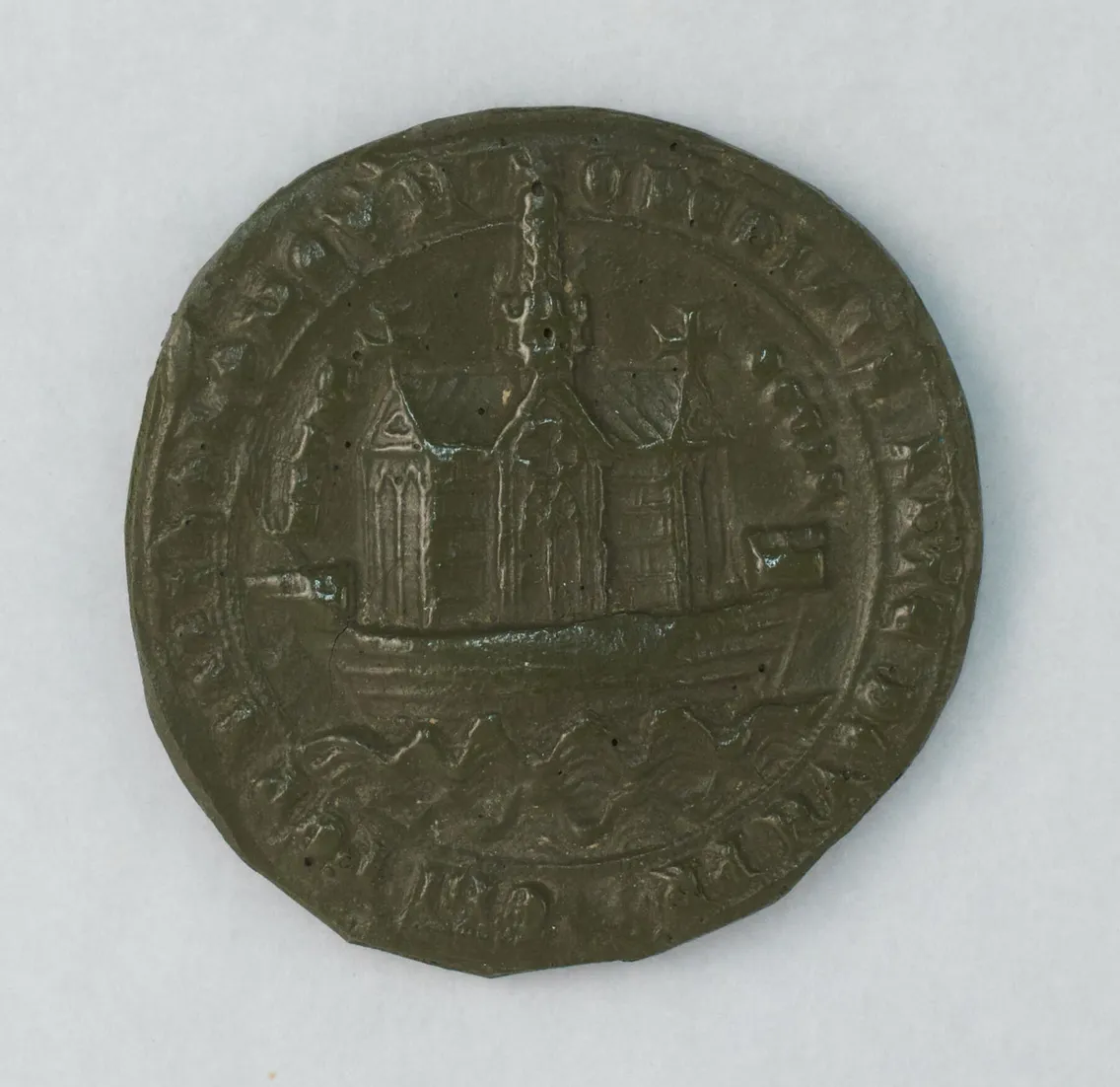 A round, dark wax seal depicting a building with pointed roofs on a boat, surrounded by raised, partially legible text around the edge.