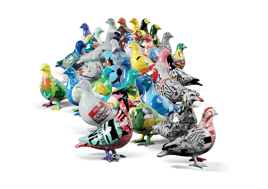 A group of pigeon statues, each painted with different colorful patterns, arranged together on a white background.