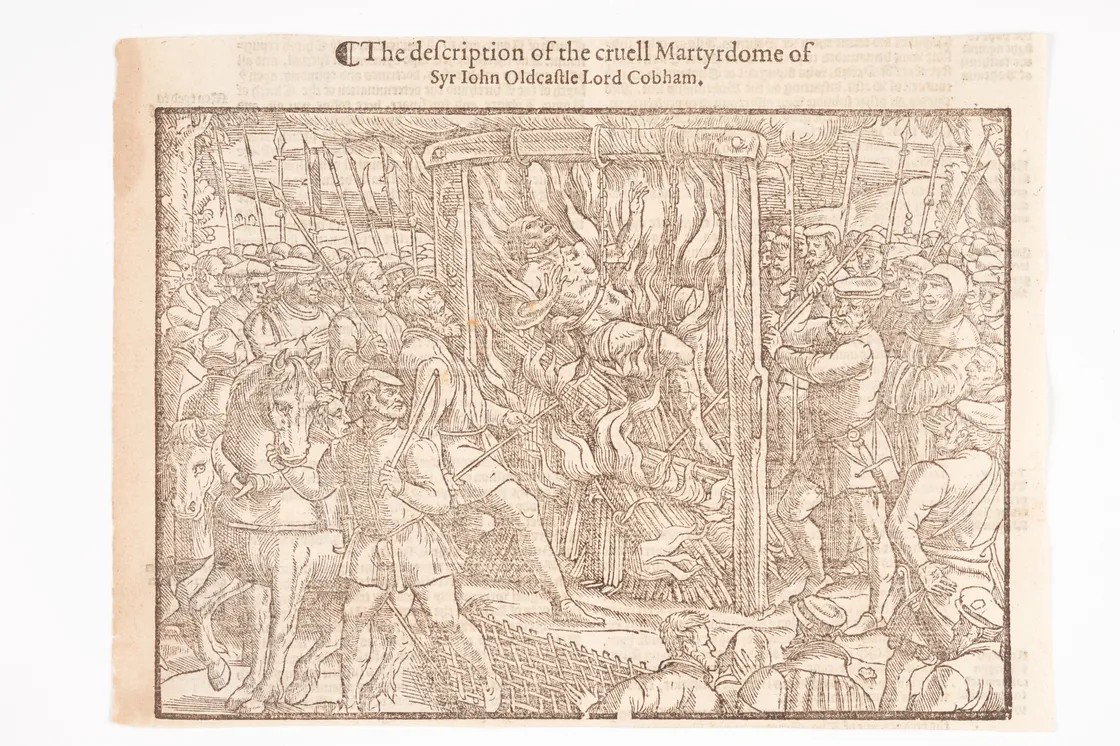 A historical engraving titled "The Description of the Cruell Martyrdome of Syr John Oldcastle Lord Cobham" depicts a chaotic scene with armed men and a central figure in distress.