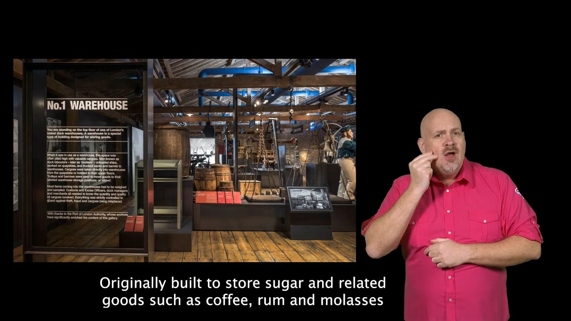 A screenshot of a BSL tour video about the No.1 Warehouse gallery