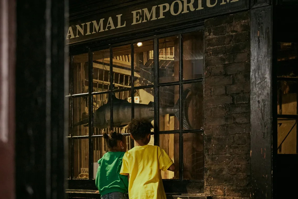 A collection of family images depicting the free-to-visit permanent galleries of the London Museum Docklands, the paid for Mudlarks family gallery and the shop.