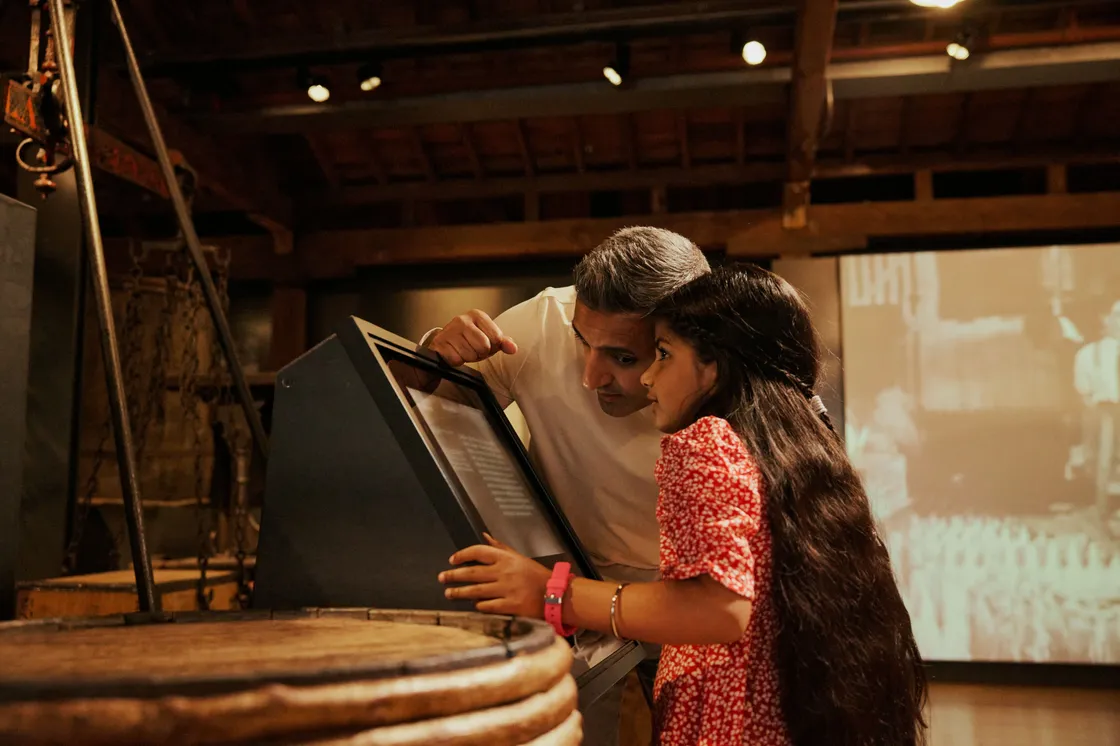 A collection of family images depicting the free-to-visit permanent galleries of the London Museum Docklands, the paid for Mudlarks family gallery and the shop.