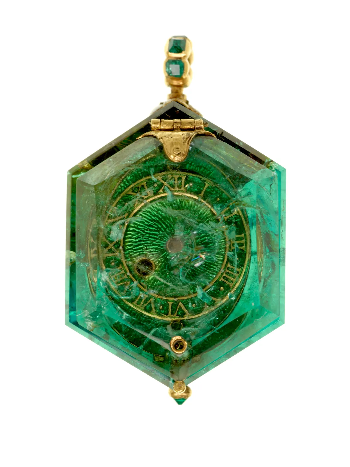 Hexagonal green gemstone pendant with intricate gold details and a central spiral design, isolated on a white background.