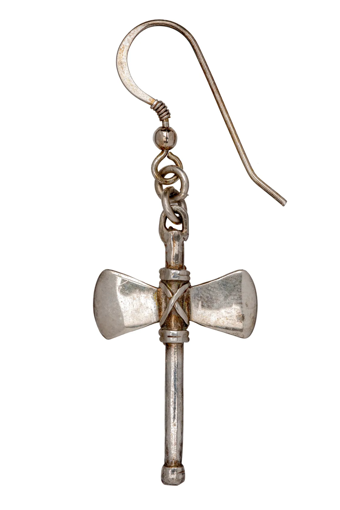 A silver earring designed in the shape of a small double-headed axe with a hook for fastening.