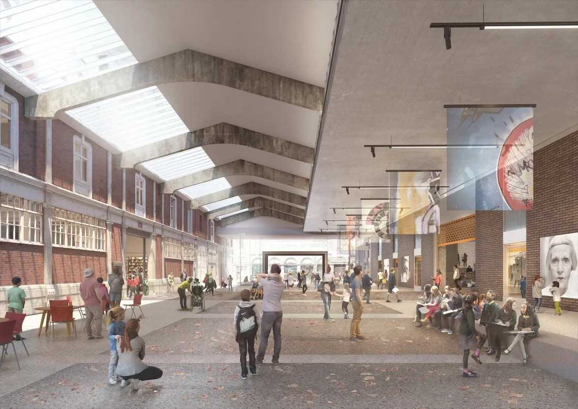 A spacious indoor public area with a high ceiling and skylights. People are walking, sitting, and engaging in various activities. Banners hang from the ceiling, and brick walls line the sides.