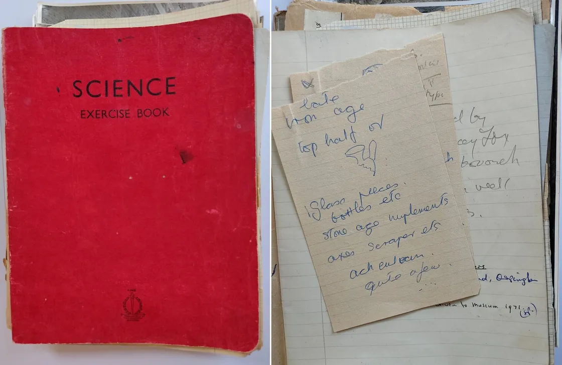 A red exercise book labeled "Science" beside a handwritten note listing tasks related to school supplies and equipment.