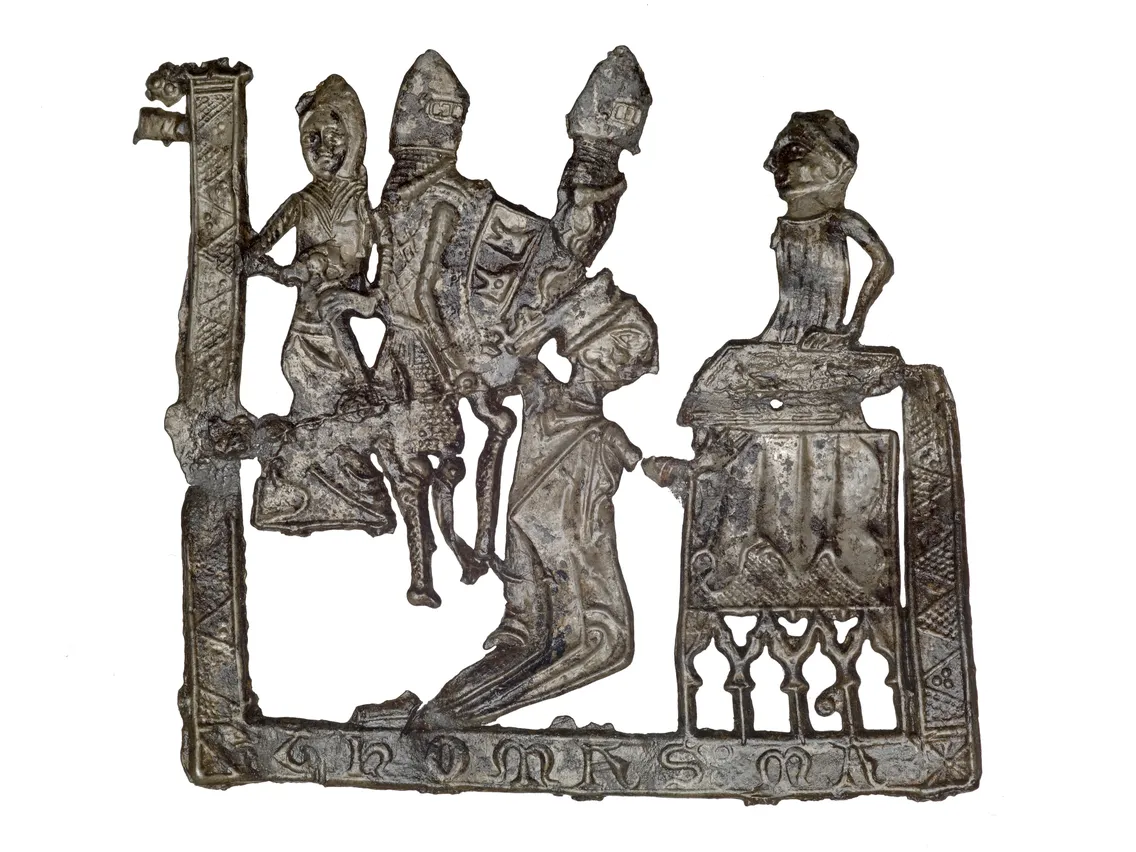 Ancient silver plaque depicting a knight and a lady, both intricately detailed, set within a decorative frame with inscriptions.
