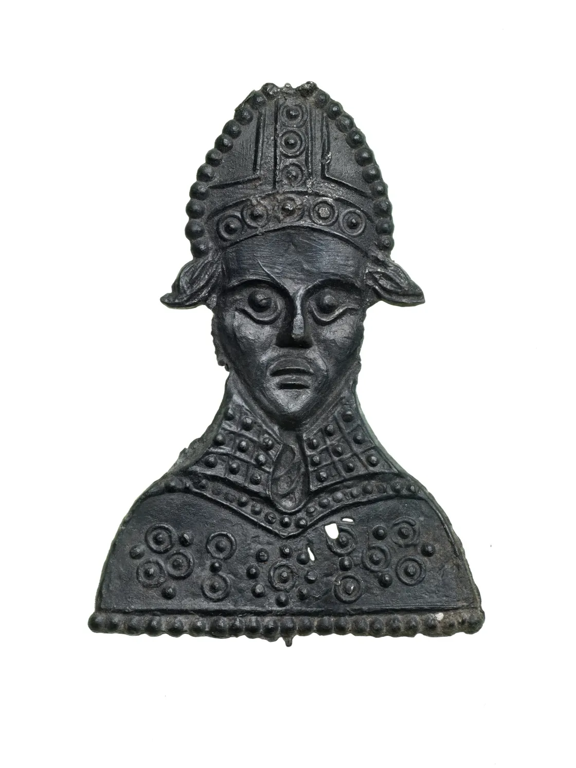 Bronze bust of a figure wearing an ornate helmet and decorated armor, set against a white background.